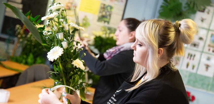 Staff making flower arrangement