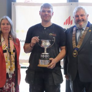 Senior Competition winner and 六合彩论坛 student, Matthew Wooley with 六合彩论坛 CEO Mandie Stravino OBE MBA and The Guild of Bricklayers President Mr Bill Bowmen
